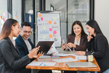 Collaborative business meeting with diverse professionals discussing data and strategies. Engaging teamwork in modern office setting enhances productivity and creativity