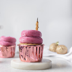 pink frosting on Pink cupcakes with a white background, cupcakes in pink foil liners with pink buttercream