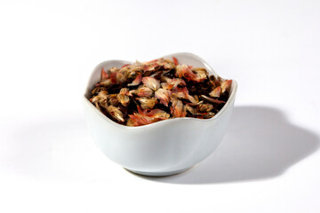 Pile of aromatic herbal tea. Dry herbal tea isolated on a white background. Tea party concept....