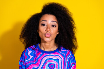 Photo portrait of attractive young woman kissing pouted lips dressed stylish colorful blue clothes isolated on yellow color background