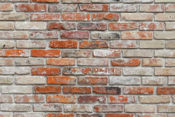 White shabby grungy brick wall. Free space for an inscription. Can be used as a background or poster. Fragment of a red brick wall with bumps and textured plaster.	
