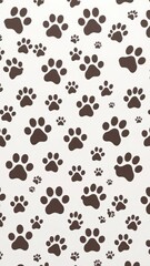 Fototapeta premium Seamless pattern of various dog paw prints in different sizes and orientations on a white background, paw print