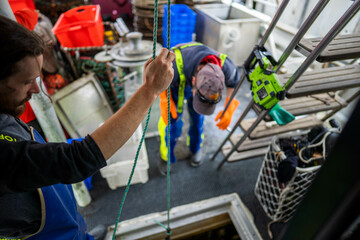 Fototapeta premium lobster fishing boat catching fish in pots and traps for the seafood industry
