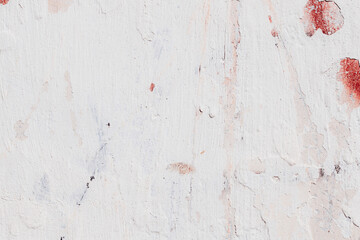 White texture of a concrete wall with natural relief and damage in the form of chips and scratches. Fragment of an old stone surface with a crack. Dark rough surface with a place for text.