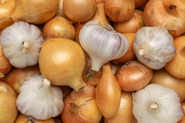 Fresh Onions and Garlic: Vibrant Arrangement of Essential Kitchen Ingredients