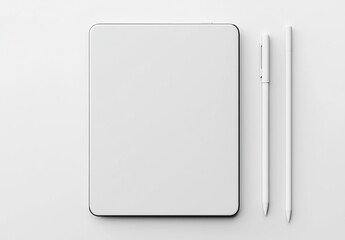 A white tablet, pen and pencil on a white background.