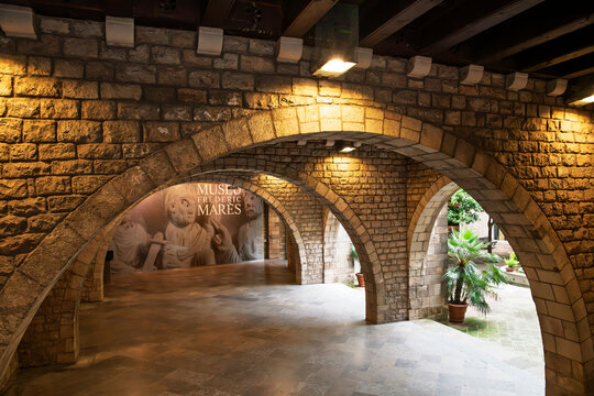 General view of the stone archway portico and garden patio at the entrance to the Museu Frederic Mar&egrave;s art and sculpture museum in the medieval Gothic Quarter of Barcelona, Spain, May 9 2023.
