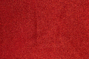 A red carpet with a lot of red glitter on it