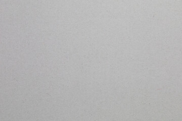 A grey background with no visible objects, textured origami paper backdrop