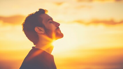 A serene moment as a man tilts his head back, closing his eyes, enjoying a peaceful sunrise and a sense of mindfulness.