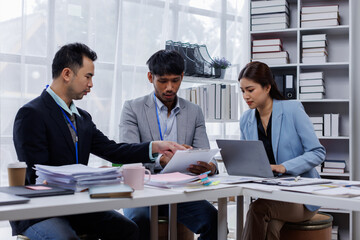 Asian business people working together in the office, Young asian people at business meeting.
