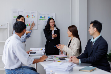 Asian business people working together in the office, Young asian people at business meeting.
