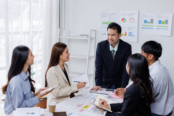 Asian business people working together in the office, Young asian people at business meeting.
