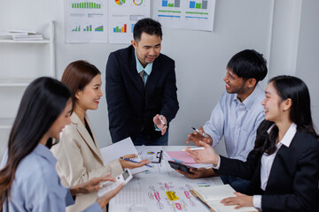 Asian business people working together in the office, Young asian people at business meeting.
