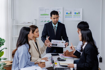 Asian business people working together in the office, Young asian people at business meeting.
