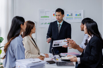 Asian business people working together in the office, Young asian people at business meeting.
