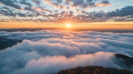 Fototapeta premium A breathtaking sunset over a sea of clouds, showcasing nature's beauty and tranquility.