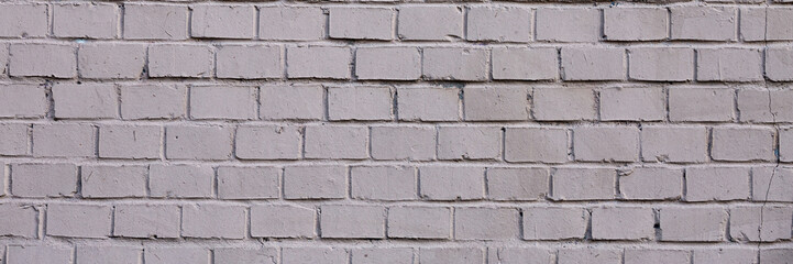 Painted brick wall. The texture of the brickwork. Wide panoramic background with masonry.