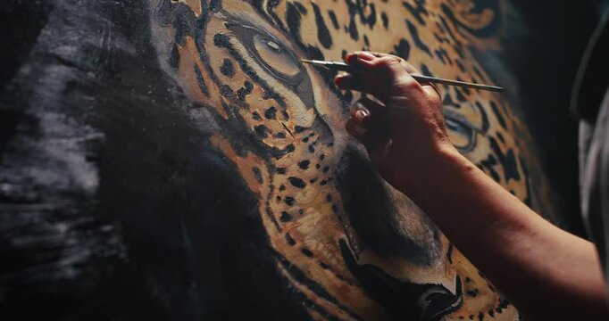 Artist Painting Leopard on Canvas
