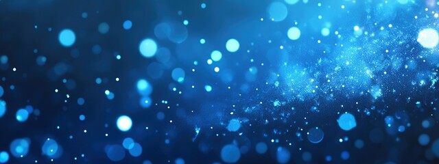 Abstract blue bokeh background with glowing lights and particles.