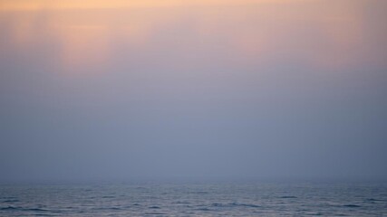 Obraz premium Sea ripple water with morning fog creates a serene and mystical atmosphere, morning, calm