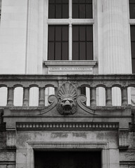 Historic Architectural Detail with Lion Sculpture and French Motto