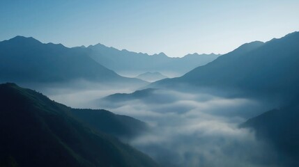 Majestic Mountain Panorama with Misty Clouds at Dawn - A Serene Aerial View
