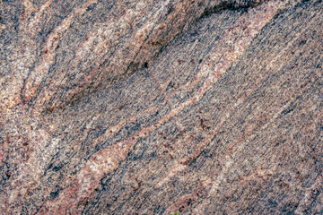 granite rock surface as natural background. Rough raw stone texture. Unique exclusive nature material. 
