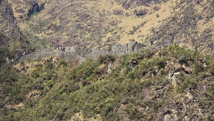 Long distant view of Sayacmarca, lost Inca miliary fortress located along the Inca Trail to Machu Picchu. It was never discovered due to its hidden location in the Andes.