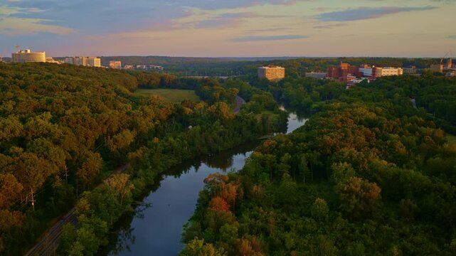 Slow-moving drone footage showing Ann Arbor&rsquo;s Huron River in Michigan during the summer.