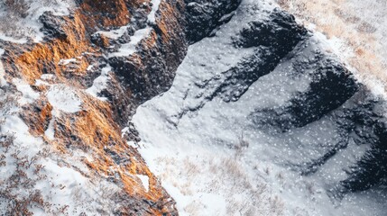 Fototapeta premium Winter Landscape with Snowy Rocks and Grass