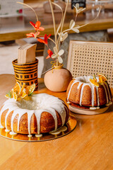 Delicious fluffy round cakes with creamy orange sauce in a luxurious hotel restaurant. Gastronomy and bakery.