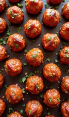 Delicious meatballs in a savory sauce, garnished with fresh herbs. Perfect for culinary projects, menus, or food-related marketing materials.