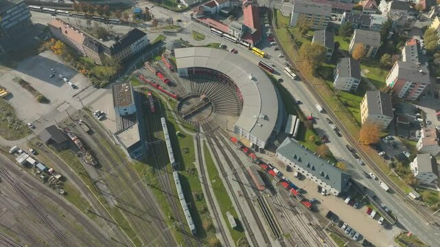 Drone over Railway Turntable Station, Wheelhouse for trains and Street Traffic, sustainable travel Salzburg, Austria. Birdseye Aerial View