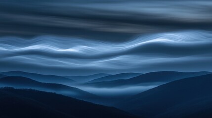 Obraz premium A serene landscape of rolling hills under a soft, wavy sky in shades of blue.