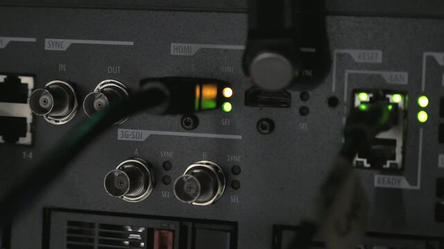 A close up of a cinema projector interface. You can see the HDMI cable connected and in use. There are other free ports around.