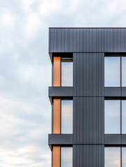 Obraz premium Modern architectural design with wood accents in a contemporary urban building at dusk