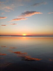 sunset over the sea with pink clouds