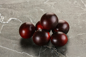 Raw ripe black kumato tomato