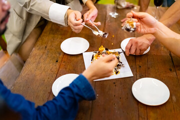 Group of Happy Asian millennials generation people friends enjoy and fun celebration reunion meeting at dinner party and eating dessert cake together in the garden at restaurant on holiday vacation.