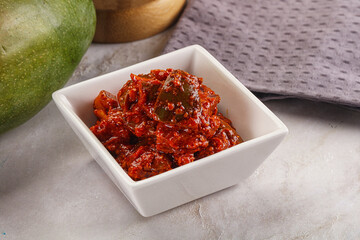 Spicy pickled raw green mango