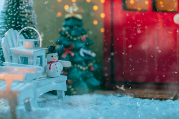Snowy Scene with Snowman and Christmas Decorations