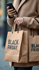 A person holding shopping bags marked "Black Friday," while using a smartphone. Perfect for retail, marketing, and holiday promotions, copy space
