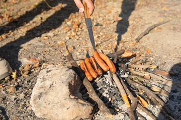 Preparing sausage barbecue in outdoor.