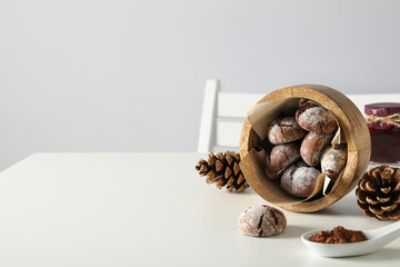 Delicious crinkle cookies in a plate, on a light background.