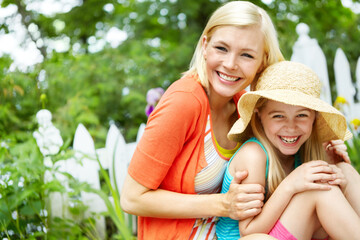 Portrait, happy mother and child relax in garden for love, care and bonding together. Face, girl and kid with mama outdoor for family connection, relationship and daughter with hat with parent in USA