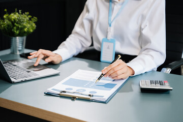 Fototapeta premium Business accountant or financial expert analyze business report graph and finance chart.