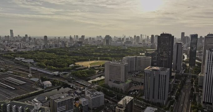 Osaka Japan Aerial v71 flyover Shiginonishi capturing views of Daini Neya river, Osakajo park, railway station and Chuo Ward downtown cityscape at sunset - Shot with Mavic 3 Pro Cine - Oct 9th 2023