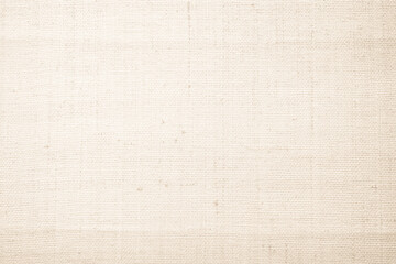 Closeup detail of beige fabric texture background. High resolution photo.