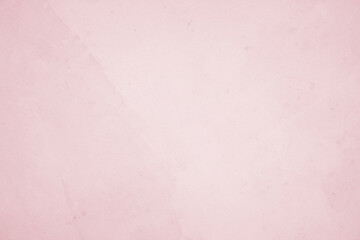 A vintage pink paper texture background with a grunge feel, perfect for art and design projects.